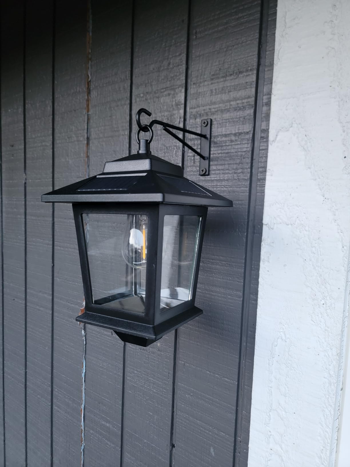 PASAMIC 2 Pack Solar Wall Lanterns with Replaceable Bulb, Outdoor Hanging Solar Lights with 4 Solar Panels, Dusk to Dawn Led Outdoor Wall Sconce, Anti-Rust Waterproof Wall Lanterns with Hooks - Customer Photo 1