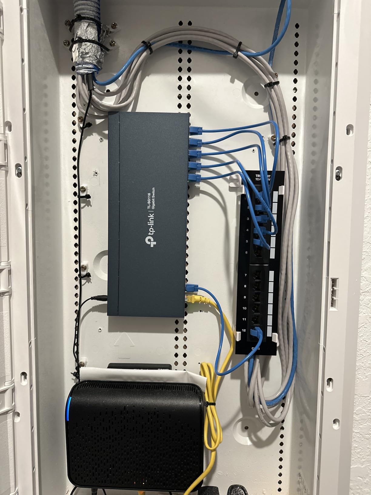 TRENDnet 12-Port Cat6 Unshielded Patch Panel, TC-P12C6V, Wall Mount, Included 89D Bracket, Vertical or Horizontal Installation, Compatible w/ Cat5e & Cat6 RJ45 Cabling, 110 IDC Type Terminal Blocks Black customer photo 1