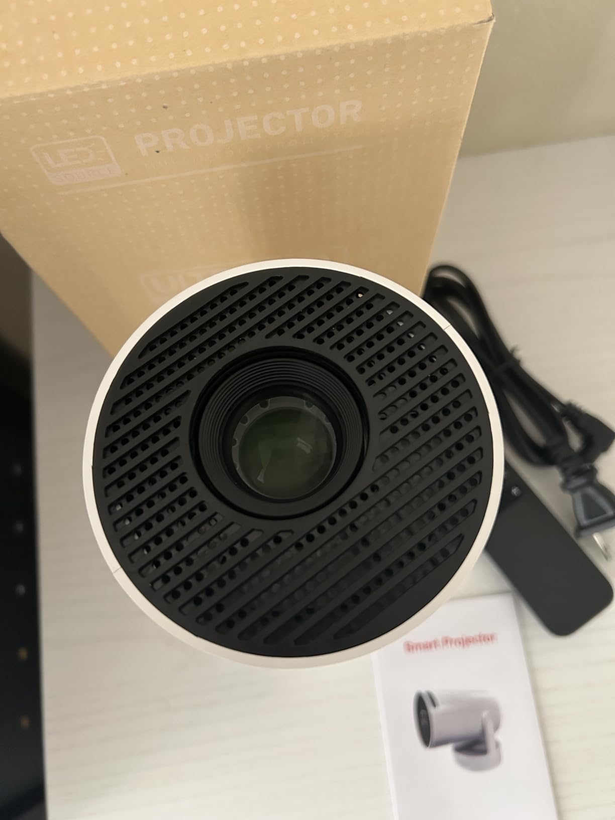 Mini Projector with WiFi and Bluetooth, Smart Portable Movie Projector 4K Support, 300 ANSI, 5W Base Speaker, 220° Rotation, Auto Vertical Keystone, Compatible with USB/HDMI/TV Stick/Laptop/Smartphone customer photo 1