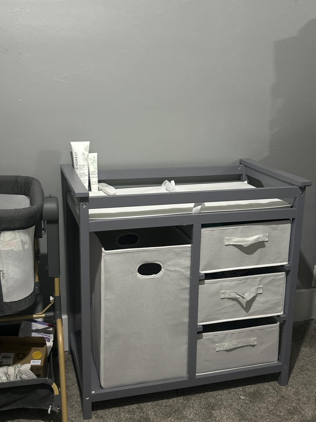 Badger Basket Modern Baby Changing Table - Nursery Furniture with Laundry Hamper and 3 Storage Drawers - Diaper Changing Station with Safety Belt, Changing Pad, and Organizer Baskets - White customer photo 2