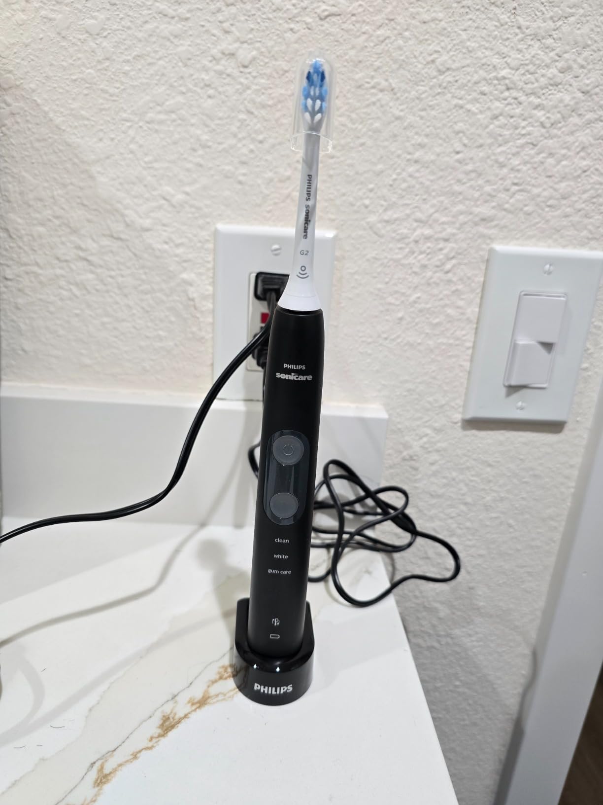 Philips Sonicare ProtectiveClean 5100 Rechargeable Electric Toothbrush, with Pressure Sensor, 3 Cleaning Modes, SmarTimer and QuadPacer, 14-Day Battery Life, Travel Case, Black, Model HX6850/60 customer photo 1